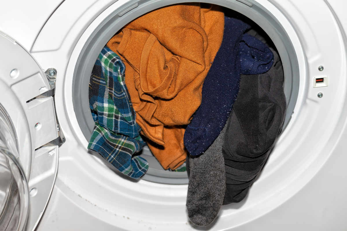Bulky clothes bunched to one side of a front load washer drum causing an unbalanced load