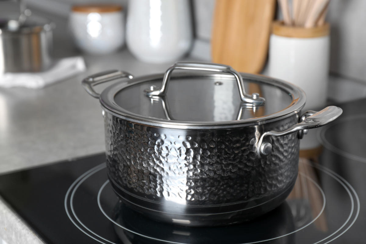 Stainless steel pot sitting on an induction stove not working in a kitchen